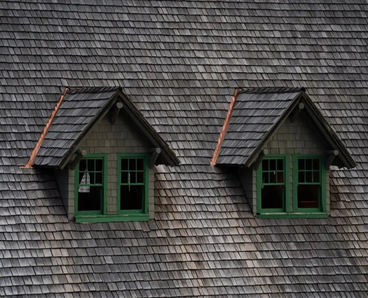 Dormers on a shingle roof in Port St. Lucie, FL, where step flashing and kickout flashing carry water past the walls